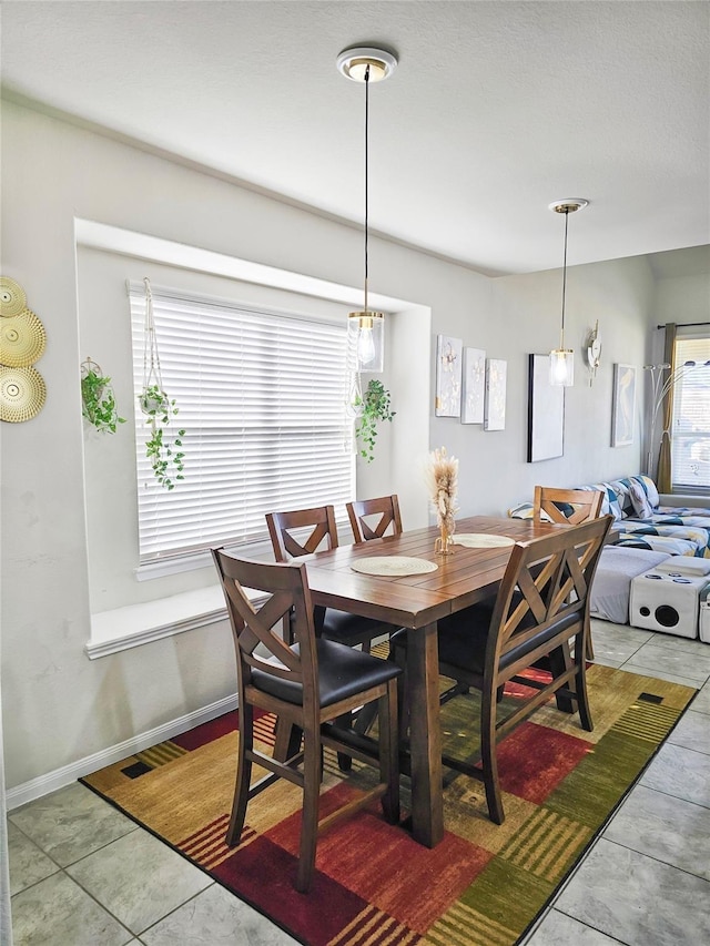 3519 Rossini Dr, Katy, TX 77493 - dining room with light tile patterned floors and baseboards