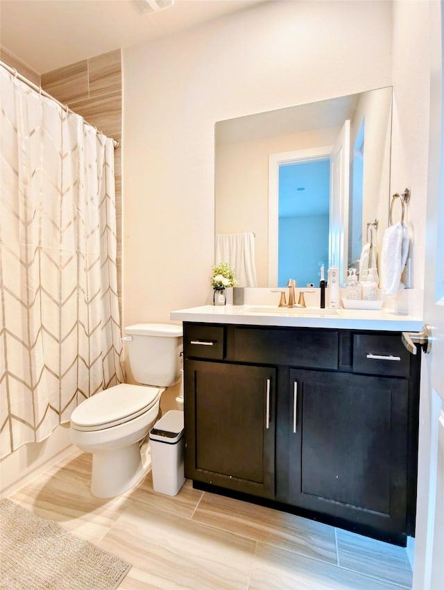 1840 Parana Dr, Houston, TX 77080 - bathroom with toilet, vanity, and a shower with curtain