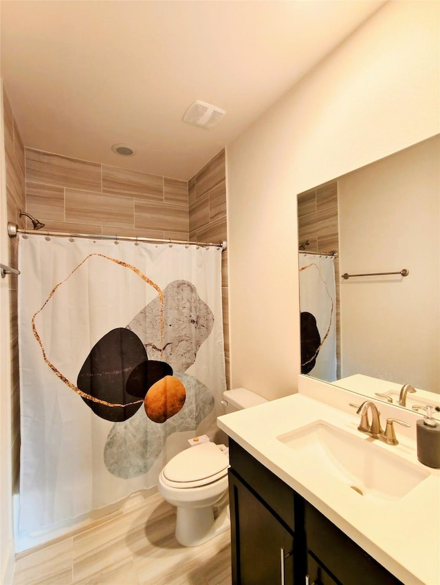 1840 Parana Dr, Houston, TX 77080 - full bathroom featuring vanity, toilet, and tiled shower