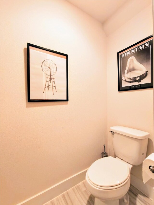 1840 Parana Dr, Houston, TX 77080 - bathroom featuring baseboards, toilet, and wood finished floors