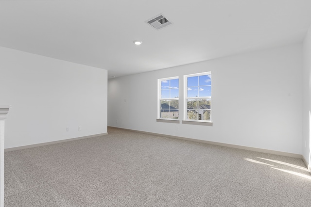 407 Emma St, Angleton, TX 77515 - spare room featuring light carpet, baseboards, and recessed lighting