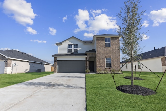 407 Emma St, Angleton, TX 77515 - traditional-style home featuring concrete driveway, brick siding, a front yard, and an attached garage