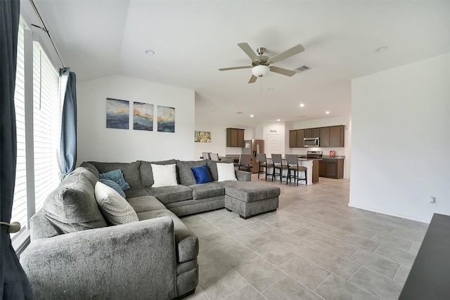1023 Cattle Chute Ct, Rosharon, TX 77583 - living room with a ceiling fan, vaulted ceiling, recessed lighting, and light tile patterned floors