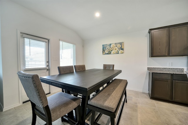1023 Cattle Chute Ct, Rosharon, TX 77583 - dining space featuring lofted ceiling, baseboards, and light tile patterned flooring
