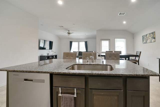 1023 Cattle Chute Ct, Rosharon, TX 77583 - kitchen with stainless steel dishwasher, a sink, light stone countertops, open floor plan, and healthy amount of natural light