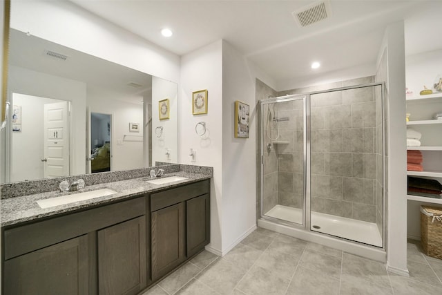 1023 Cattle Chute Ct, Rosharon, TX 77583 - bathroom with double vanity, a stall shower, baseboards, tile patterned floors, and recessed lighting