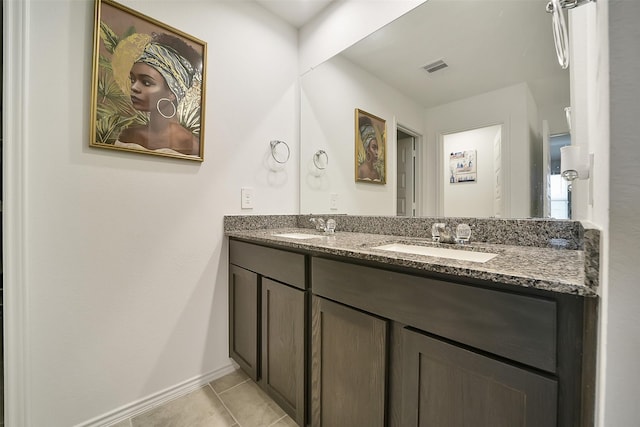 1023 Cattle Chute Ct, Rosharon, TX 77583 - full bathroom featuring double vanity, tile patterned flooring, and baseboards