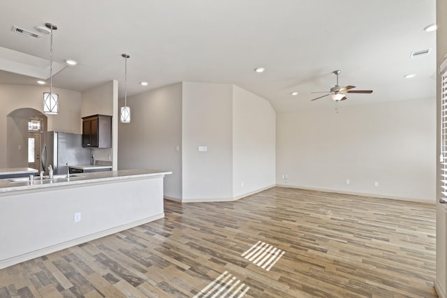 5207 Corbridge Glen Ct, Katy, TX 77449 - kitchen with ceiling fan, light wood-type flooring, recessed lighting, light countertops, and freestanding refrigerator