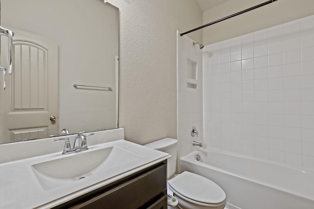 5207 Corbridge Glen Ct, Katy, TX 77449 - bathroom featuring a textured wall, toilet, vanity, and bathtub / shower combination