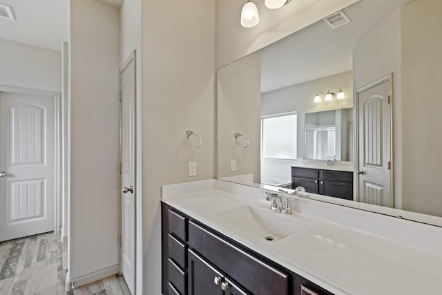5207 Corbridge Glen Ct, Katy, TX 77449 - full bath with wood finished floors and two vanities