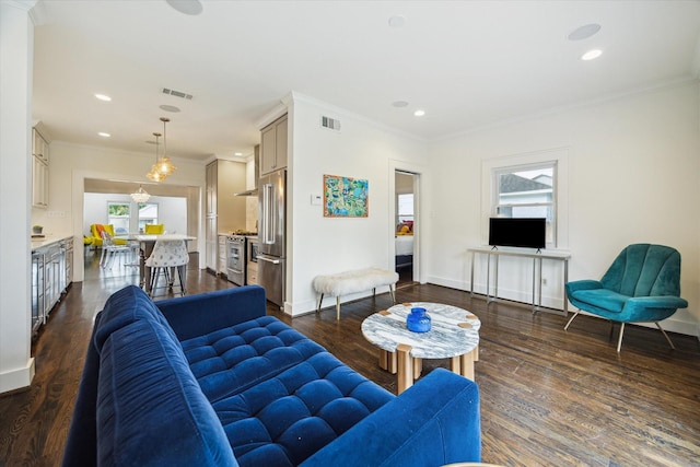 1130 Merrill St, Houston, TX 77009 - living room featuring ornamental molding, recessed lighting, dark wood-style flooring, and baseboards