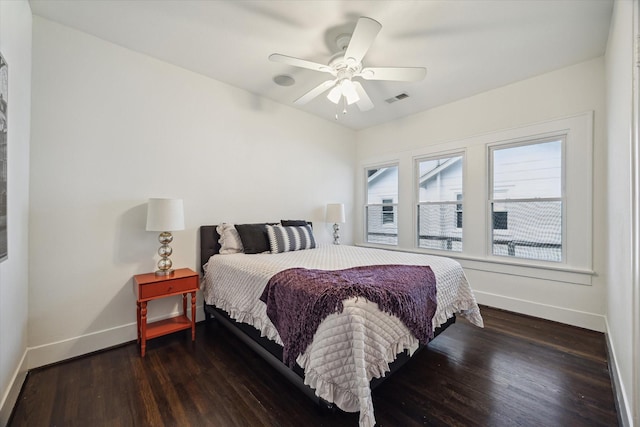 1130 Merrill St, Houston, TX 77009 - bedroom featuring baseboards, wood finished floors, and ceiling fan