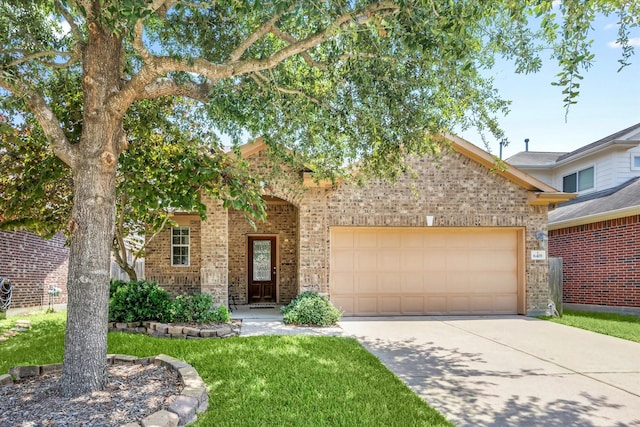 6419 Genet Dr, Katy, TX 77494 - view of front of property featuring brick siding, concrete driveway, a garage, and a front yard