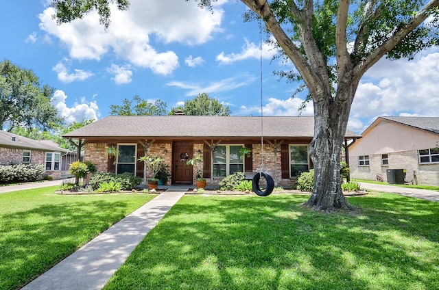 12023 Scottsdale Dr, Meadows Place, TX 77477 - ranch-style house featuring brick siding, a front yard, and central air condition unit