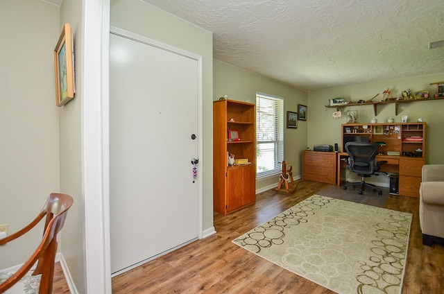 12023 Scottsdale Dr, Meadows Place, TX 77477 - office space with wood finished floors, a textured ceiling, and baseboards
