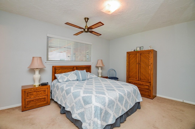 12023 Scottsdale Dr, Meadows Place, TX 77477 - bedroom with light carpet, baseboards, a textured ceiling, and a ceiling fan
