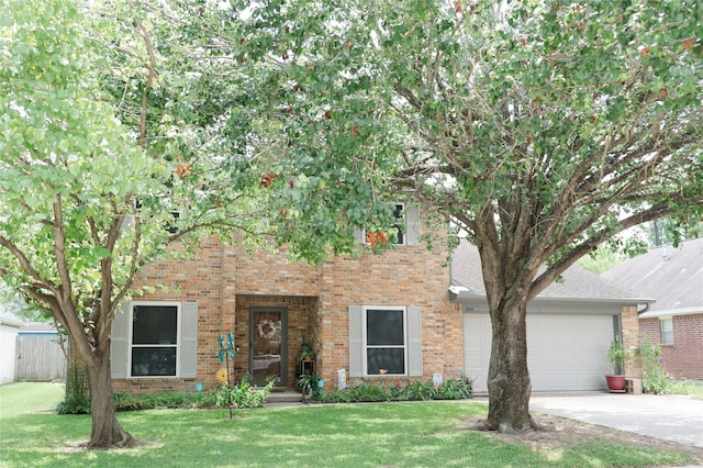 6014 Ghana Ln, Pasadena, TX 77505 - view of front of home with driveway, brick siding, a garage, and a front yard