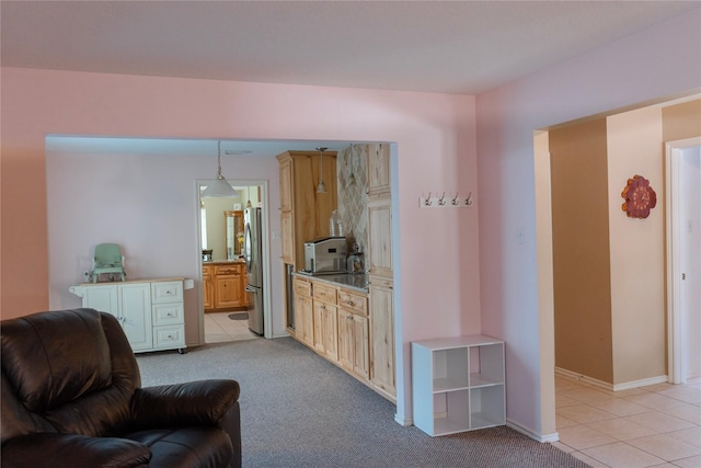 6014 Ghana Ln, Pasadena, TX 77505 - living area with light tile patterned floors, light colored carpet, and baseboards
