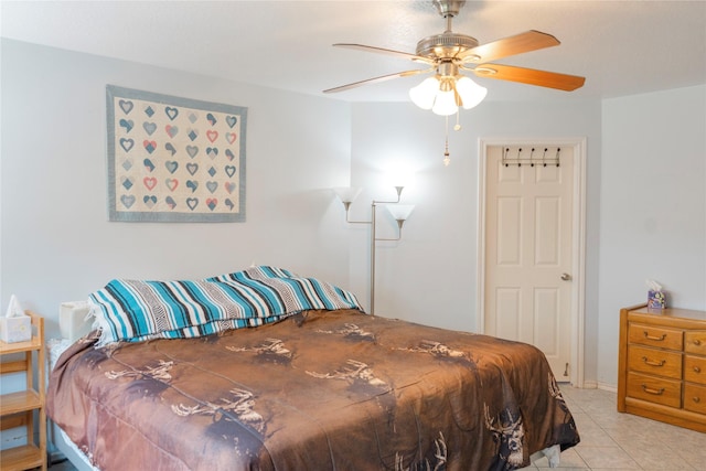 6014 Ghana Ln, Pasadena, TX 77505 - bedroom featuring light tile patterned floors and a ceiling fan
