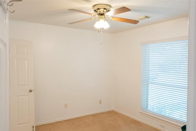 6014 Ghana Ln, Pasadena, TX 77505 - empty room with light colored carpet, ceiling fan, and baseboards