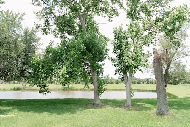 6014 Ghana Ln, Pasadena, TX 77505 - view of grassy yard featuring a water view