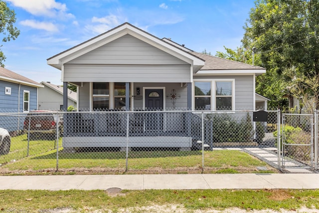 1505 Hussion St, Houston, TX 77003 - shotgun-style home with covered porch and a gate