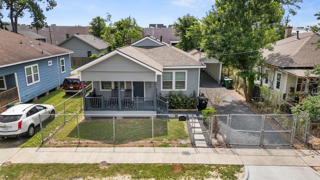 1505 Hussion St, Houston, TX 77003 - view of front facade featuring a porch, a gate, and a shingled roof