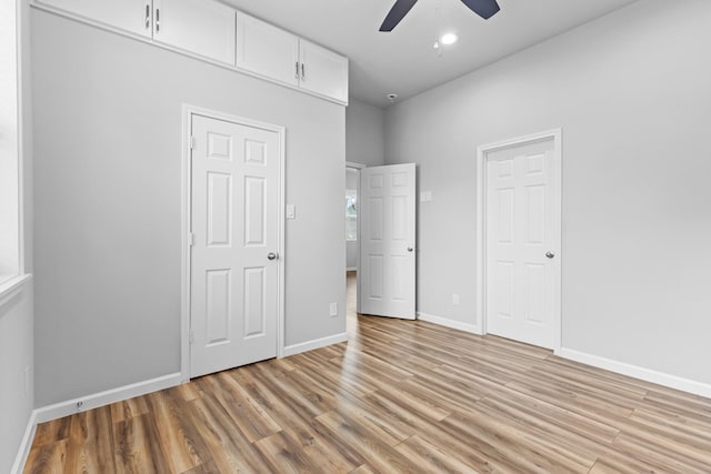 1505 Hussion St, Houston, TX 77003 - unfurnished bedroom featuring light wood finished floors, baseboards, and a ceiling fan