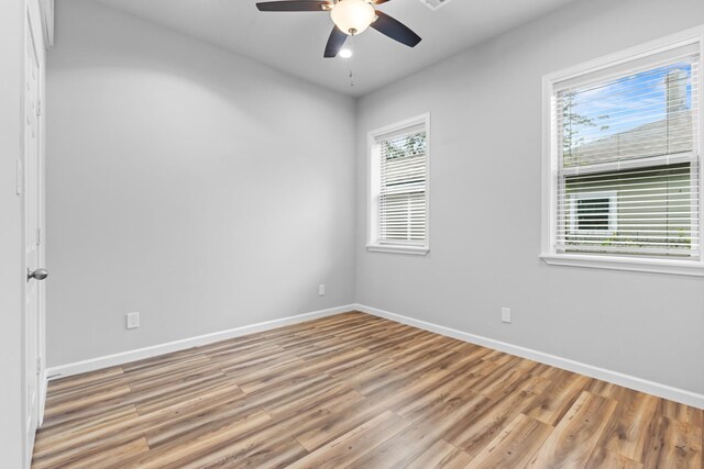 1505 Hussion St, Houston, TX 77003 - unfurnished room with light wood-style flooring, baseboards, and a ceiling fan