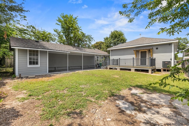 1505 Hussion St, Houston, TX 77003 - back of house featuring a lawn, a wooden deck, and roof with shingles