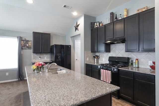 14726 Meadow Acre Trl, Houston, TX 77049 - kitchen with black appliances, under cabinet range hood, a sink, a kitchen island with sink, and light stone counters