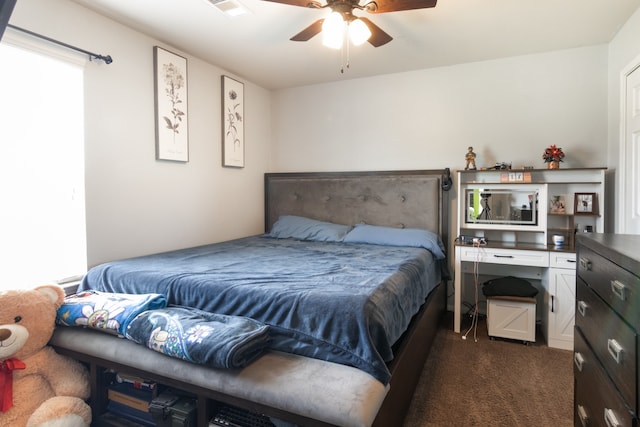 14726 Meadow Acre Trl, Houston, TX 77049 - bedroom featuring dark colored carpet and a ceiling fan