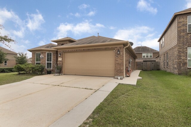 14726 Meadow Acre Trl, Houston, TX 77049 - view of front of house with brick siding, concrete driveway, a garage, and roof with shingles