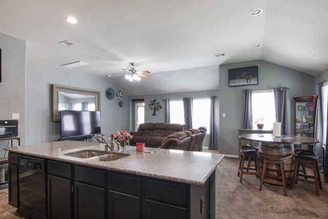 14726 Meadow Acre Trl, Houston, TX 77049 - kitchen featuring a sink, lofted ceiling, beverage cooler, a ceiling fan, and a kitchen island with sink