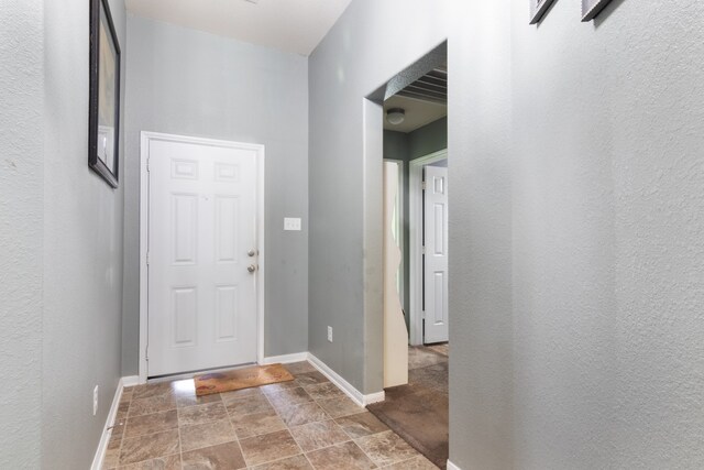 14726 Meadow Acre Trl, Houston, TX 77049 - entrance foyer with stone finish floors and baseboards