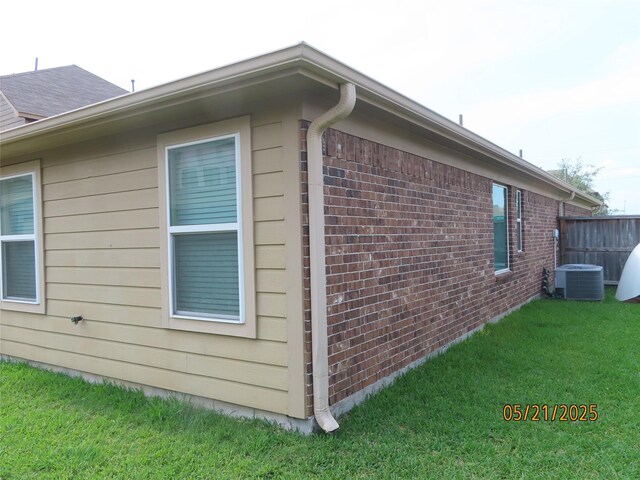 14726 Meadow Acre Trl, Houston, TX 77049 - view of side of property with brick siding and central air condition unit