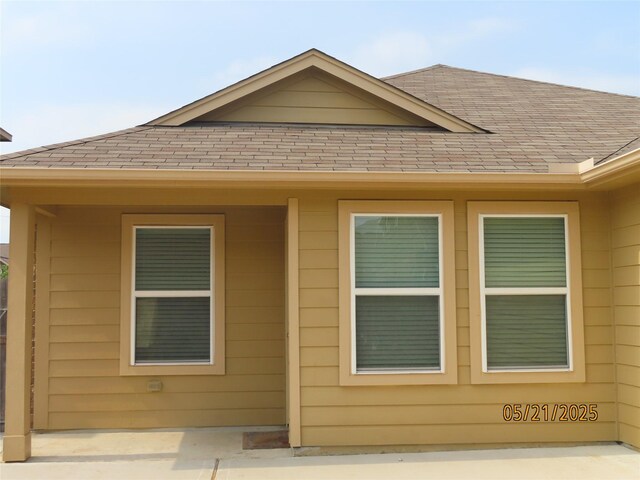 14726 Meadow Acre Trl, Houston, TX 77049 - view of property exterior with roof with shingles