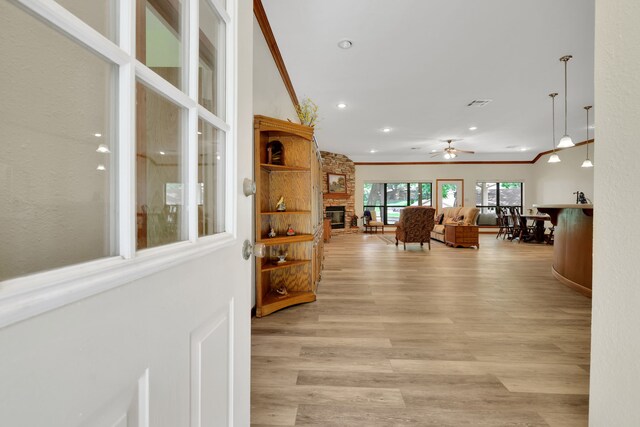 210 Harbor Run Dr, Coldspring, TX 77331 - hall with crown molding, light wood-style floors, and recessed lighting