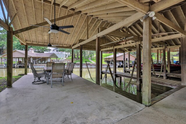 210 Harbor Run Dr, Coldspring, TX 77331 - view of patio / terrace featuring boat lift, a water view, a boat dock, and ceiling fan