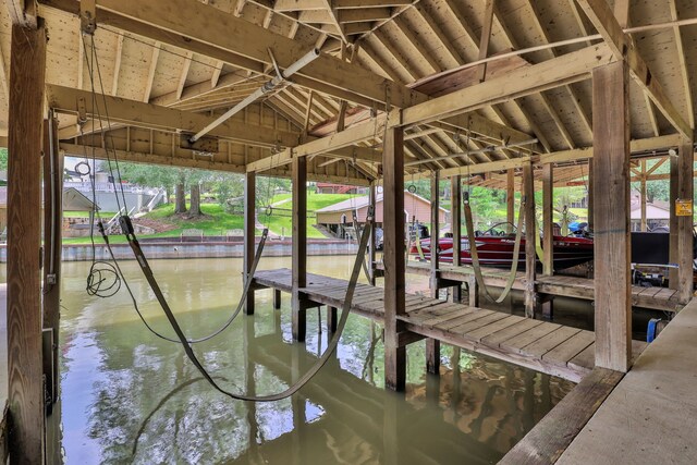 210 Harbor Run Dr, Coldspring, TX 77331 - dock area featuring boat lift and a water view
