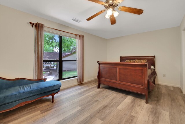 210 Harbor Run Dr, Coldspring, TX 77331 - bedroom featuring light wood-style floors, baseboards, and ceiling fan