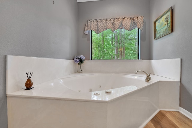 210 Harbor Run Dr, Coldspring, TX 77331 - full bathroom with wood finished floors and a whirlpool tub