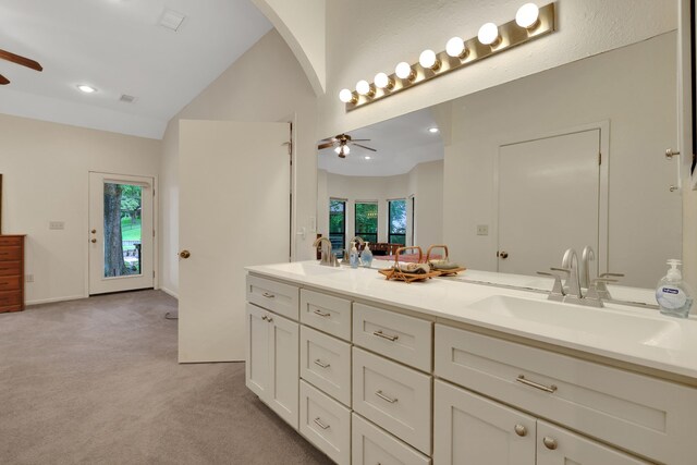 210 Harbor Run Dr, Coldspring, TX 77331 - bathroom featuring a ceiling fan, lofted ceiling, double vanity, and recessed lighting