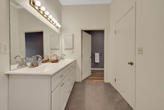 210 Harbor Run Dr, Coldspring, TX 77331 - bathroom with double vanity and baseboards