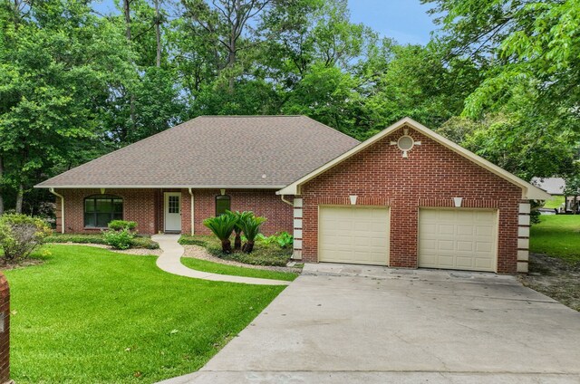 210 Harbor Run Dr, Coldspring, TX 77331 - view of front of property featuring driveway, a front yard, an attached garage, and roof with shingles