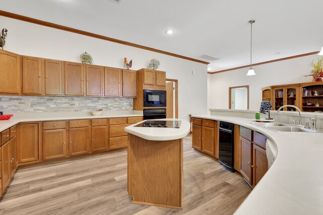 210 Harbor Run Dr, Coldspring, TX 77331 - kitchen with a sink, black appliances, ornamental molding, tasteful backsplash, and light countertops