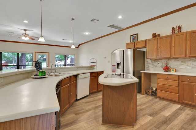 210 Harbor Run Dr, Coldspring, TX 77331 - kitchen featuring white dishwasher, a sink, crown molding, a kitchen island, and backsplash