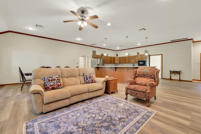 210 Harbor Run Dr, Coldspring, TX 77331 - living area featuring a ceiling fan, ornamental molding, baseboards, arched walkways, and recessed lighting