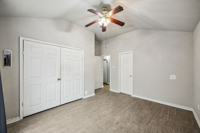16211 Beck Ridge Dr, Houston, TX 77053 - unfurnished bedroom with vaulted ceiling, wood finished floors, baseboards, a ceiling fan, and a closet