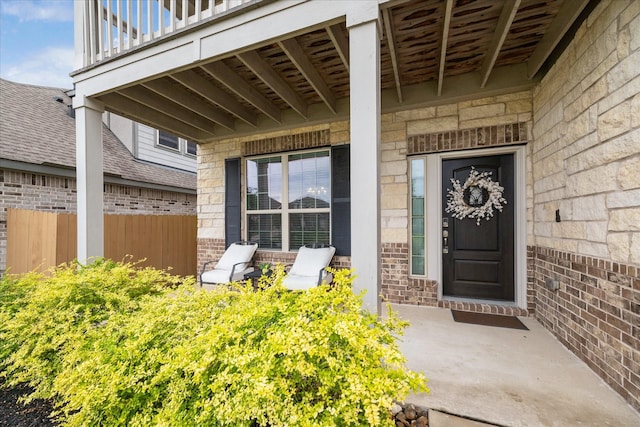 4423 Mimic Dr, Spring, TX 77386 - property entrance with brick siding, stone siding, and a porch